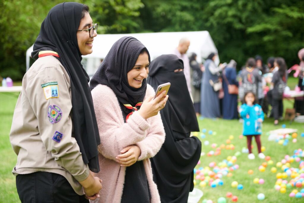 Scout volunteers with Explorer Scouts at camp